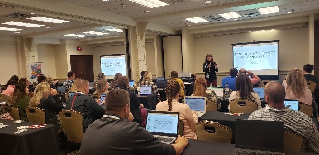 Christy Hilton presents to a room of educators at the HECC conference. 