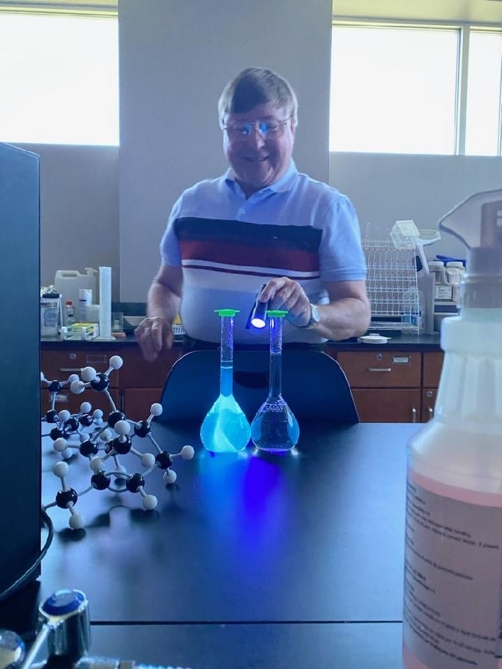 A teacher shines a light on science experiments. 