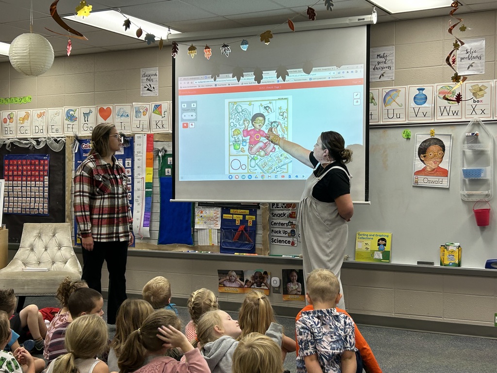 Mrs. Hubble (left) and Heather Snodgrass co-teach a literacy lesson to a kindergarten class.